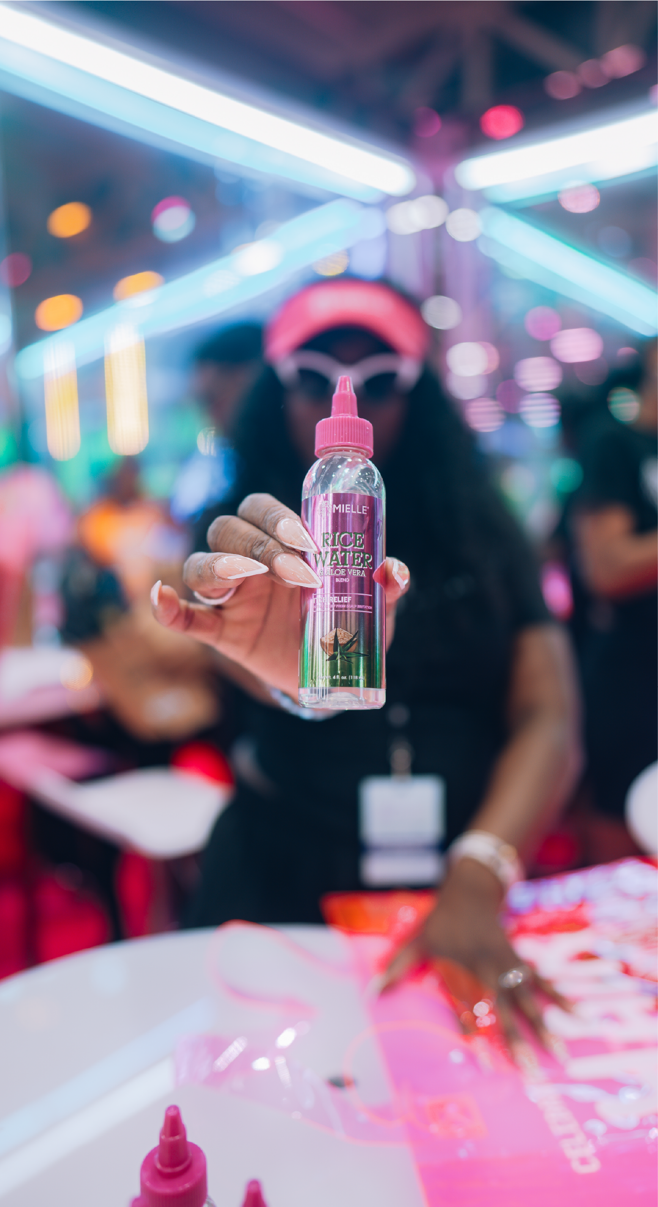 Woman engaging with Mielle brand activation